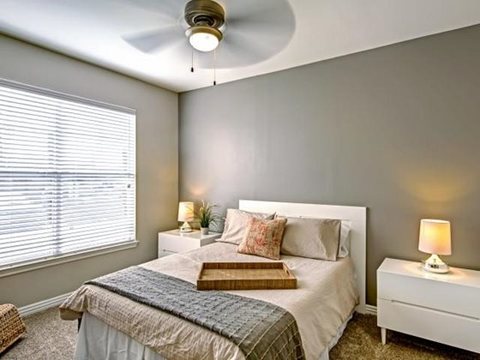 The Pavilions - Cozy Bedroom with Large Window and Ceiling Fan